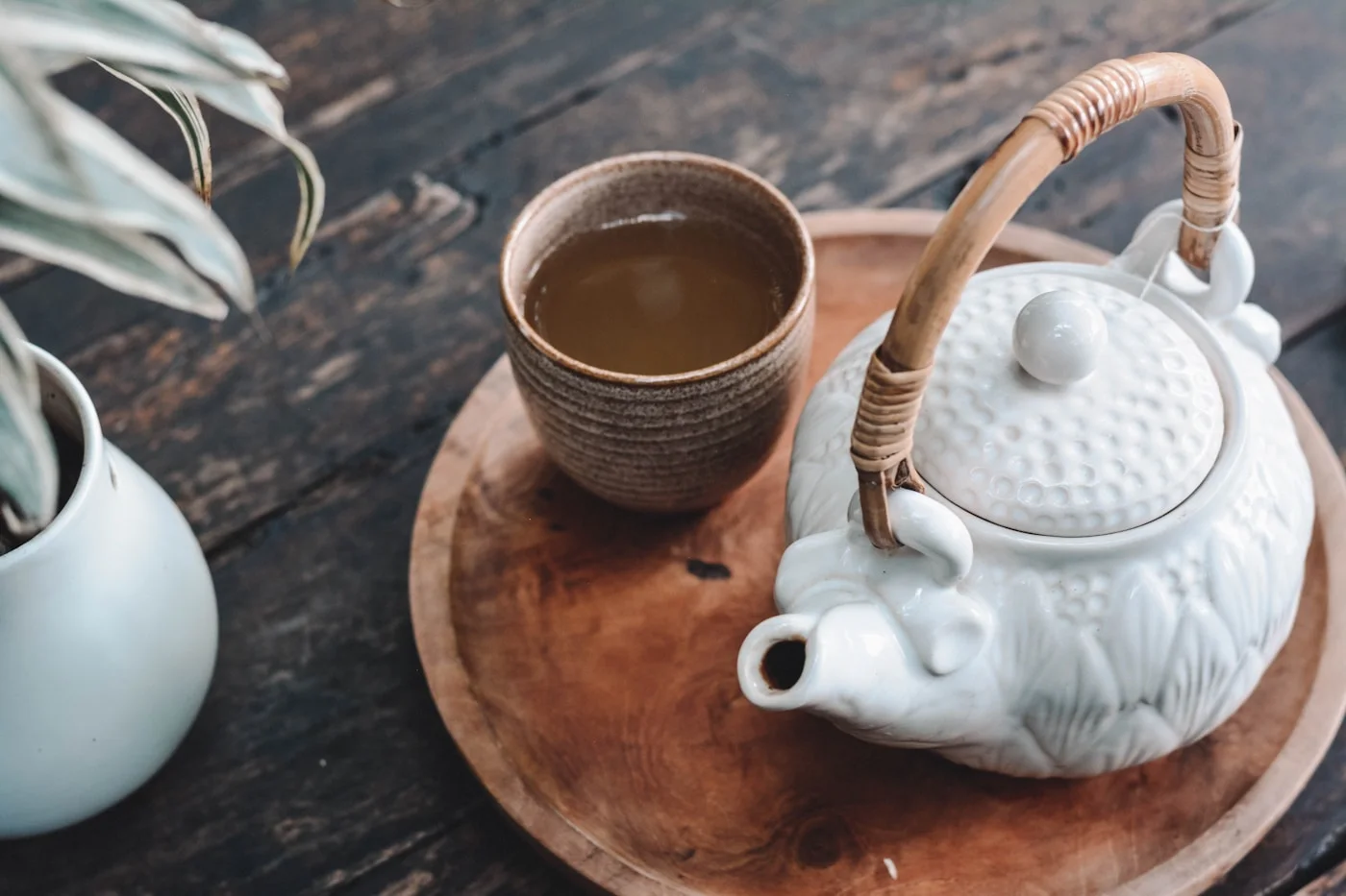 A considered tea ritual with a porcelain teapot and cups